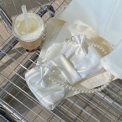 Elegant Satin Clutch with Exquisite Pearl Handle