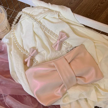 Elegant Satin Clutch with Exquisite Pearl Handle