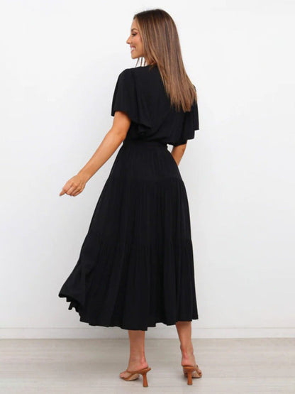 Chic Bohemian Midi Dress with V-Neck and Flowy Tiered Skirt